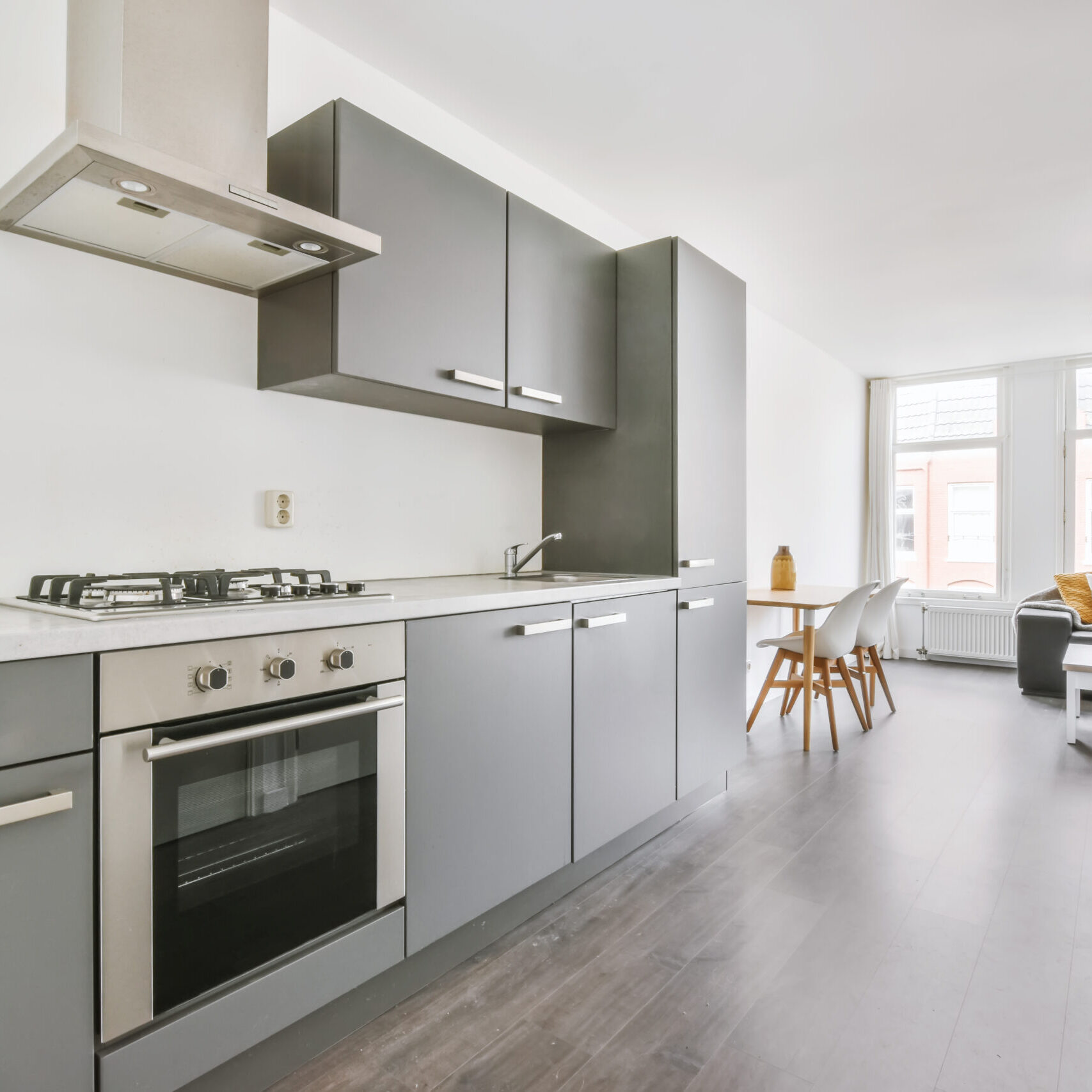 Elegant and cozy kitchen with gray kitchen unit